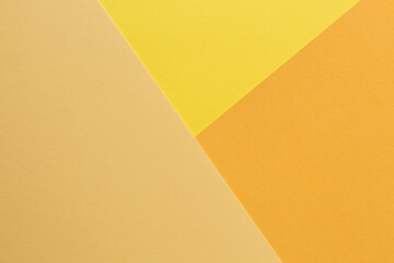 The paper yellow and orange colors is lying on the table