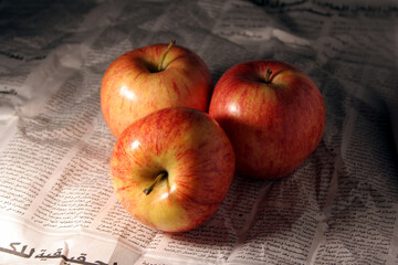 three apples on paper page
