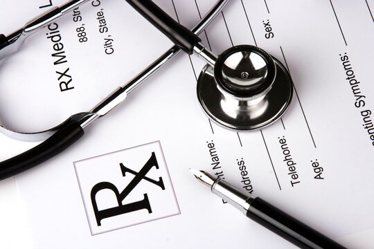 A Stethoscope over a medical report form.