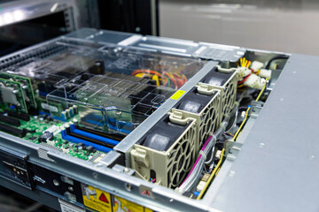 Inside view of opened multiprocessor server in rack frame of IT datacenter. Picture of what a air-cooled system in the server platform looks like.