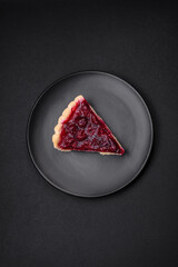 Delicious fragrant sweet pie with cherry berries on a ceramic plate