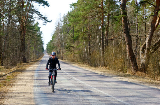 Traveling cyclists on forest road