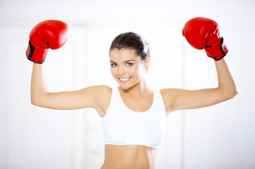 Young beautiful woman during fitness time and boxing