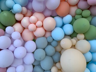 Background texture: Multicolored inflatable balls. Festive background of gel balloons. Lots of balloons of different sizes.