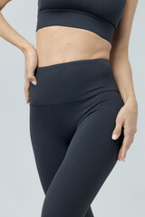 Fototapeta premium a girl in a black tracksuit on a white background