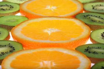 Fototapeta na wymiar Background oranges and kiwi