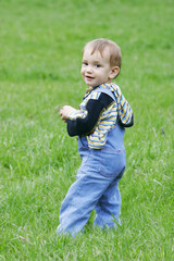 cute baby boy on grass background