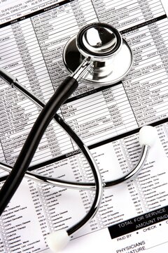A Stethoscope over a medical report form.