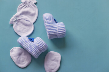 blue color Knitted shoes for an infant. 