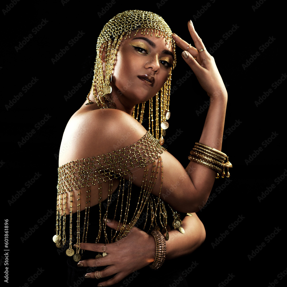 Wall mural African woman, portrait and gold fashion with beauty and cosmetics in a studio. Isolated, black background and young female face with crown, Egypt jewelry and culture empowerment with queen pride