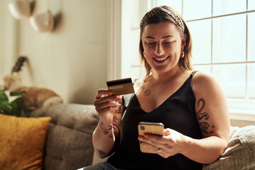 Phone, credit card and woman on sofa online shopping, e commerce and fintech payment, loan or happy...