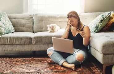 Laptop, credit card and woman stress, anxiety or depression for home loan, payment debt or fintech problem on floor. Headache, sad and depressed person with dog on computer, banking scam or mistake