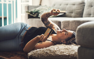 Woman, credit card and phone on floor for online shopping, e commerce and fintech payment, loan or finance at home. Happy person relax on ground, typing and internet banking on mobile app transaction