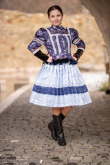 Beautiful woman wearing traditional Eastern Europe folk costumes. Slovak folk costumes.
