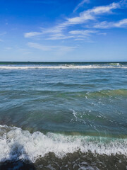 The Tide Comes In With Waves In The Distance In Florida
