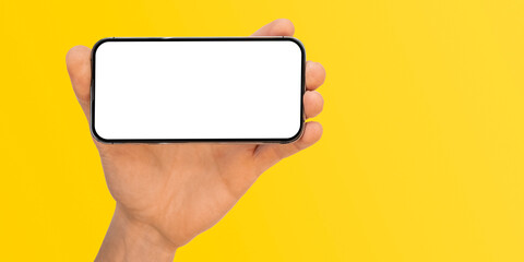 phone in hand on a colorbackground