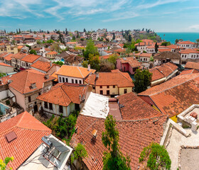 Fototapeta na wymiar Aerial view of the buildings in the Kaleichi district in the Turkish city of Antalya. View of the roofs of houses in the Kaleici district.