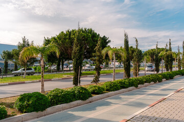 View of the street in the city of Antalya. Automobile road and pedestrian sidewalk in Antalya.