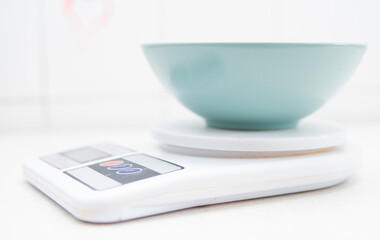 a bowl on a kitchen scale. Weighing food