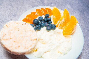 Rice cakes with curd cheese and fruit. A healthy diet, a source of carbohydrates and protein
