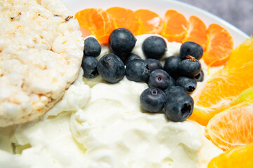 Rice cakes with curd cheese and fruit. A healthy diet, a source of carbohydrates and protein
