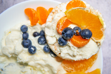 Rice cakes with curd cheese and fruit. A healthy diet, a source of carbohydrates and protein