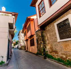 Fototapeta na wymiar Turkey. Street in the city of Antalya. Old street. An old restored house at sunset.