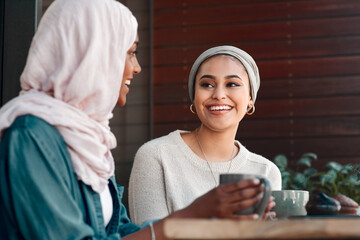 Happy, coffee and smile with Muslim women in cafe for conversation, food and social. Friends, relax and culture with arabic female customer in restaurant for discussion, happiness and meeting