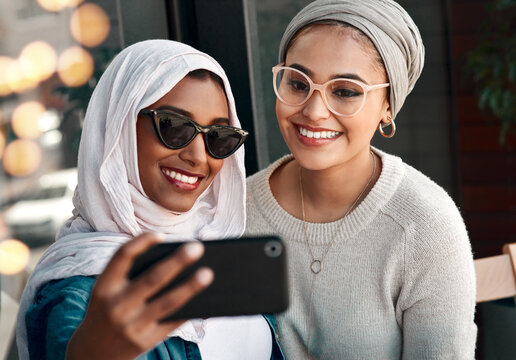 Selfie, happy muslim and women or friends in city for social media, influencer content creation and fashion blog. Young gen z people in Saudi Arabia with profile picture, photography and sunglasses