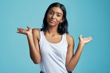 Choice, portrait and woman with option gesture in studio with question, thinking and doubt symbol....