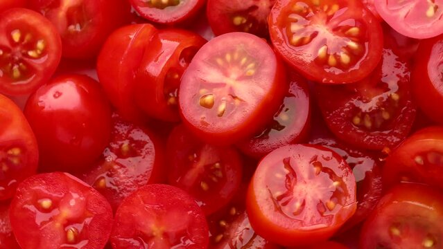 Red Cherry Tomato Slices, Rotation In Circle. Slice Tomato, Turning. Selective Focus. Red Background