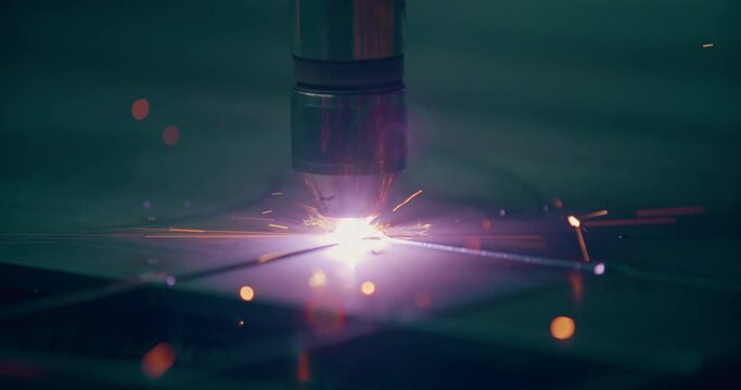 Plasma laser cutting metal sheet with sparks Welding