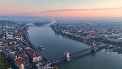 Fototapeta premium Aerial view of Hungarian Parliament Building at sunrise with the Danube river, in Budapest, Hungary