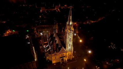 Establishing Aerial View Shot of Matthias church and Fishermans Bastion at night. Budapest, Hungary