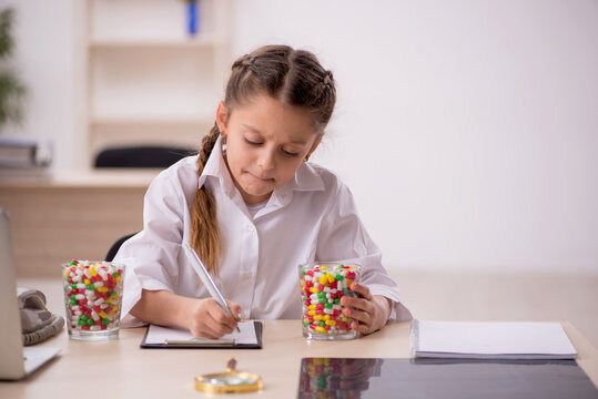 Small girl playing doctor in the clinic