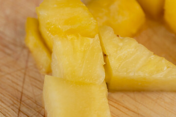 Sliced into pieces of fresh ripe peeled pineapple