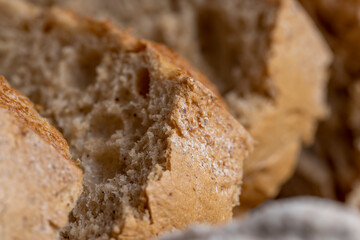 A loaf of bread made of wheat and rye flour cut into pieces