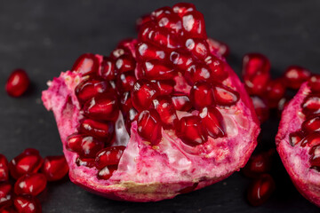 peeled red ripe pomegranate with red sweet grains