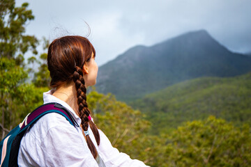 Beautiful girl admires mighty, famous Mount Barney from Yellow Pinch Lookout, Closest view, Mount...