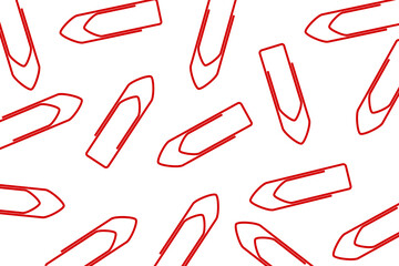 Business office pattern. A pile of red paper clips scattered on a white background	