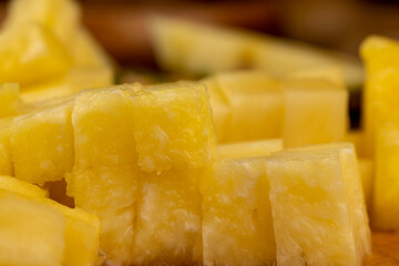 sliced ripe yellow pineapple, a large number of pieces