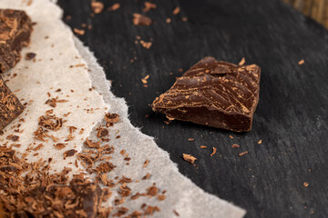 a crumbled piece of bitter chocolate into small pieces