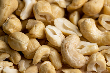 scattered pile of cashew nuts