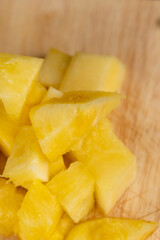 Sliced into pieces of fresh ripe peeled pineapple