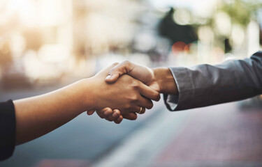 Business people, handshake and meeting in city for partnership, introduction or greeting outdoors....
