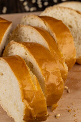 Wheat baguette on a wooden cutting board