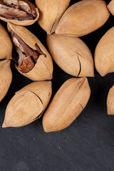 Unpeeled crunchy pecans close up