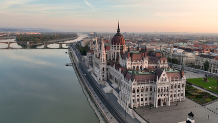 Fototapeta na wymiar Amazing Skyline Establishing Bird Eye Aerial View Shot of Budapest city. Hungarian Parliament Building with the Danube river at sunrise. Hungary