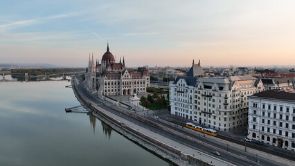 Amazing Skyline Establishing Bird Eye Aerial View Shot of Budapest city. Hungarian Parliament Building with the Danube river at sunrise. Hungary