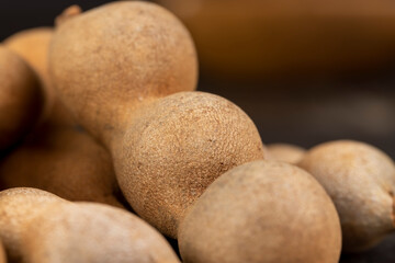 long ripe tamarind pods close up